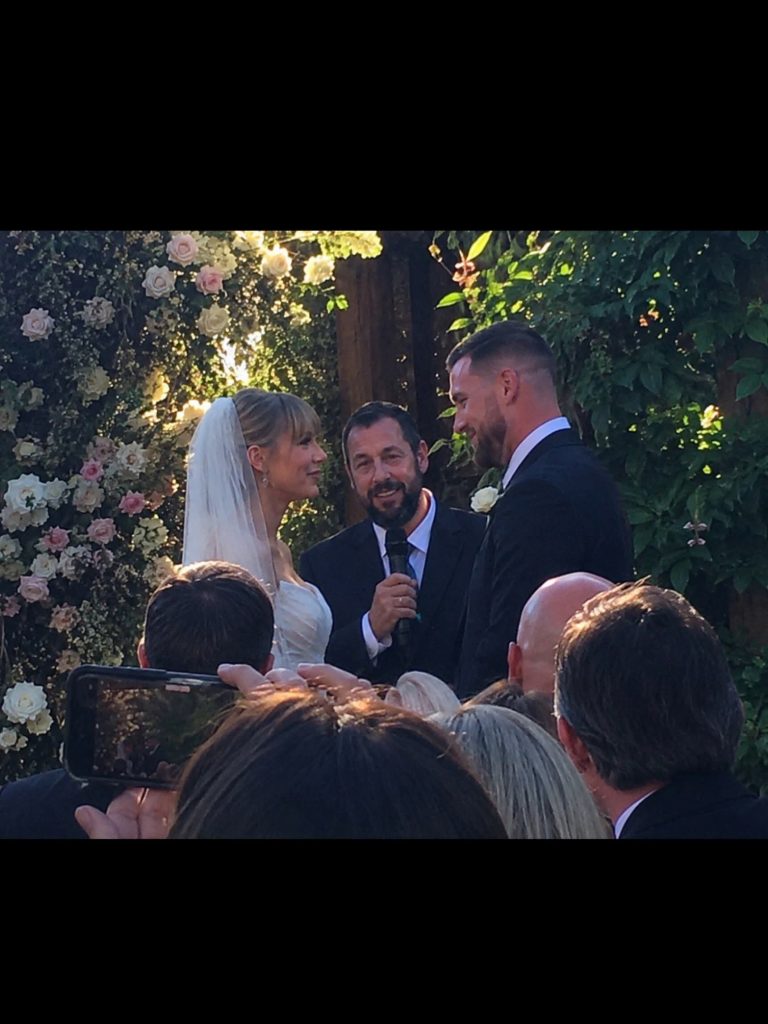 ‎First look at Taylor Swift and Travis Kelce’s wedding ceremony, officiated by Adam Sandler. ‎